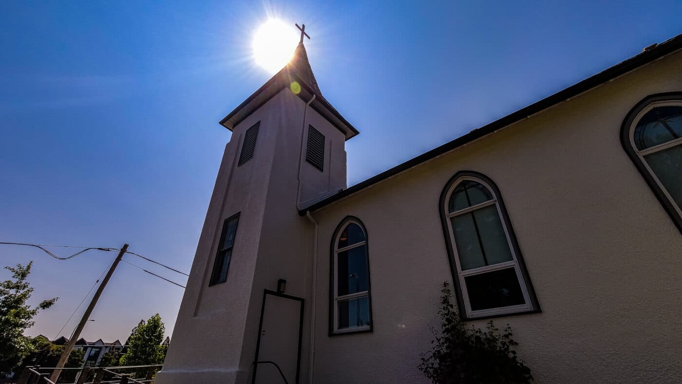 Side view of Cloverdale United Church tower and arched windows