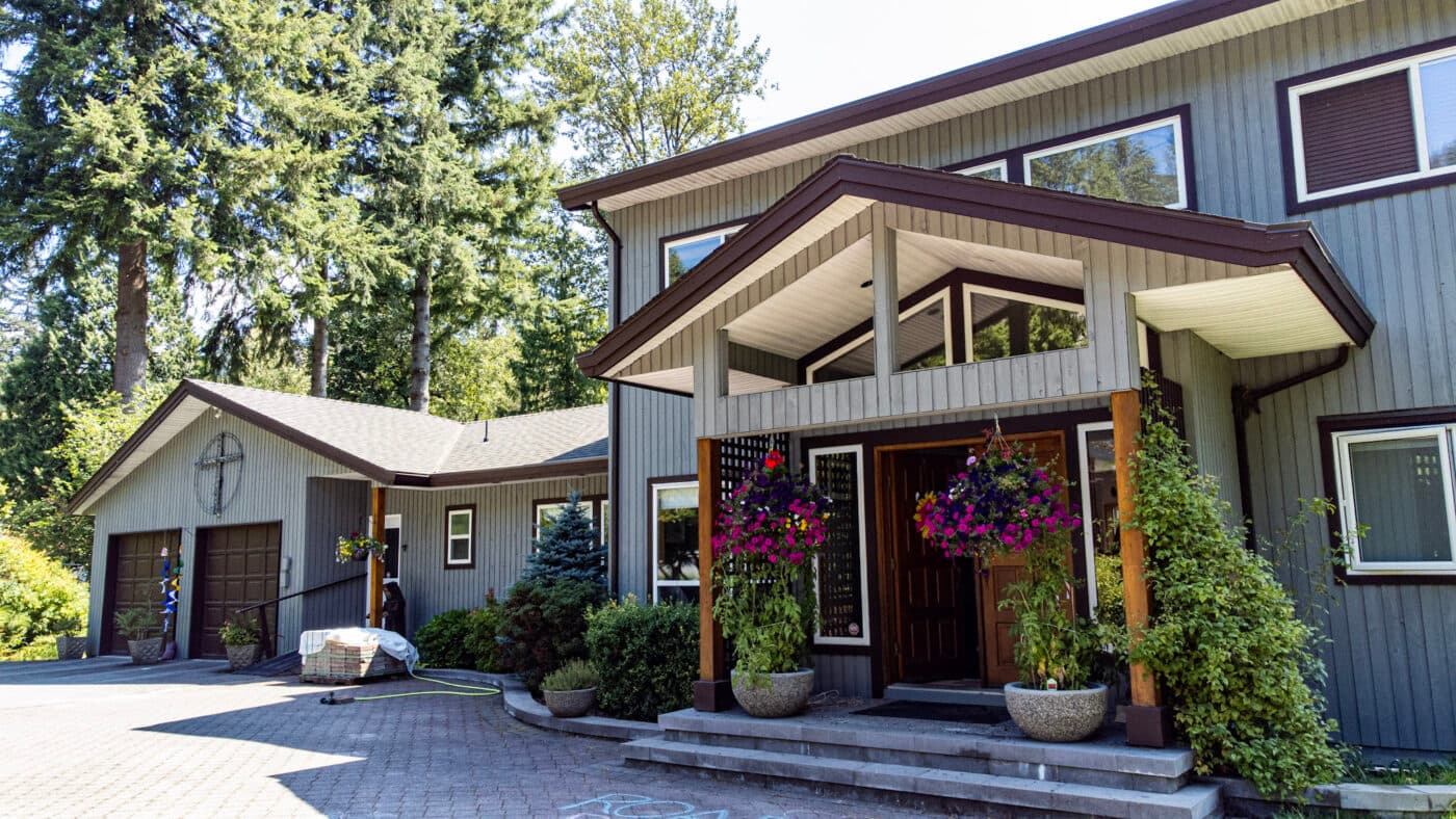 Front entrance and garage of a Coquitlam wood-sided home